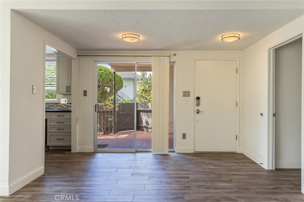 23033 Maple Avenue, Unit A Torrance, CA 90505 - Photo 4 of 45 a view of empty room with wooden floor