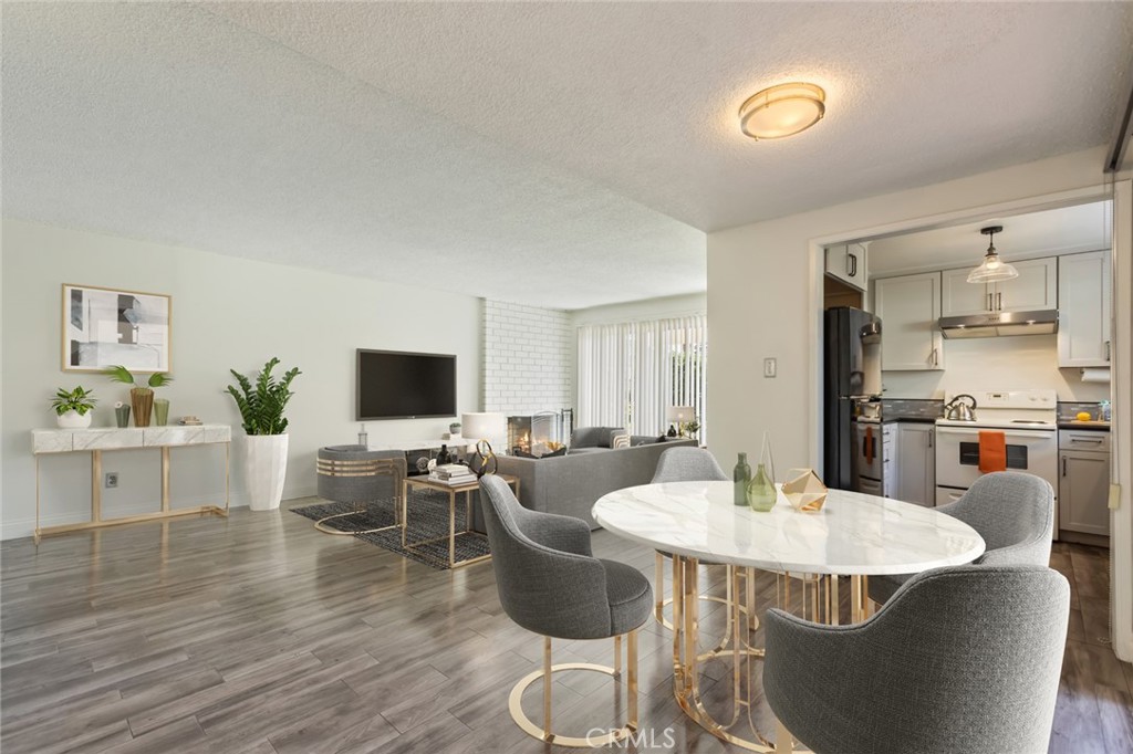 23033 Maple Avenue, Unit A Torrance, CA 90505 - Photo 5 of 45 a view of a dining room with furniture and wooden floor