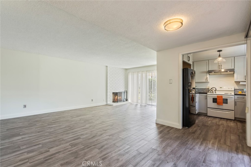 23033 Maple Avenue, Unit A Torrance, CA 90505 - Photo 6 of 45 a view of a kitchen with a sink and a stove top oven