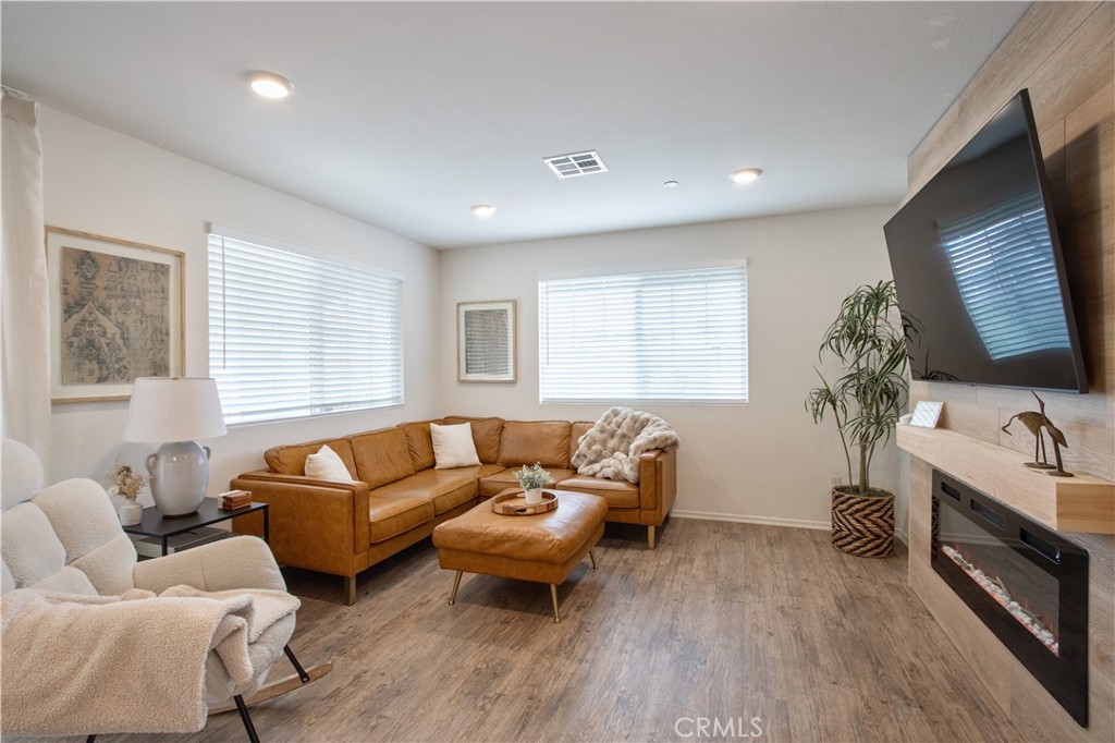 28397 Partridge Way, Unit 1001 Murrieta, CA 92563 - Photo 11 of 47 a living room with furniture flat screen tv and window