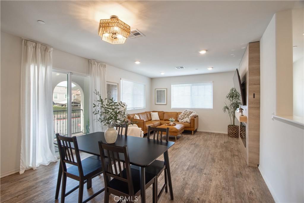 28397 Partridge Way, Unit 1001 Murrieta, CA 92563 - Photo 12 of 47 a view of a dining room with furniture window and wooden floor