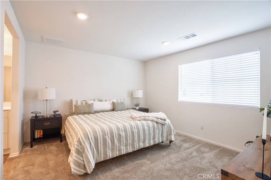 28397 Partridge Way, Unit 1001 Murrieta, CA 92563 - Photo 20 of 47 a bedroom with a bed and window