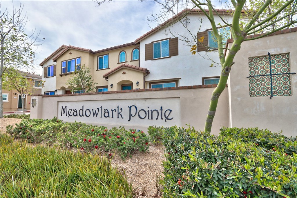 28397 Partridge Way, Unit 1001 Murrieta, CA 92563 - Photo 2 of 47 a sign on the side of a building