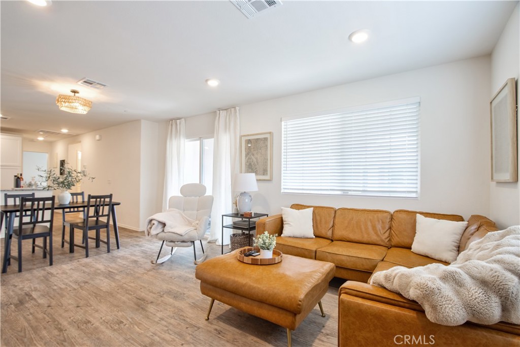 28397 Partridge Way, Unit 1001 Murrieta, CA 92563 - Photo 3 of 47 a living room with furniture and a large window