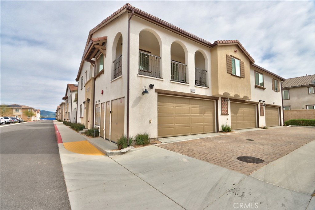 28397 Partridge Way, Unit 1001 Murrieta, CA 92563 - Photo 32 of 47 a front view of a house with a yard
