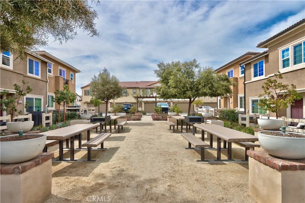 28397 Partridge Way, Unit 1001 Murrieta, CA 92563 - Photo 34 of 47 a view of a patio with swimming pool and sitting area