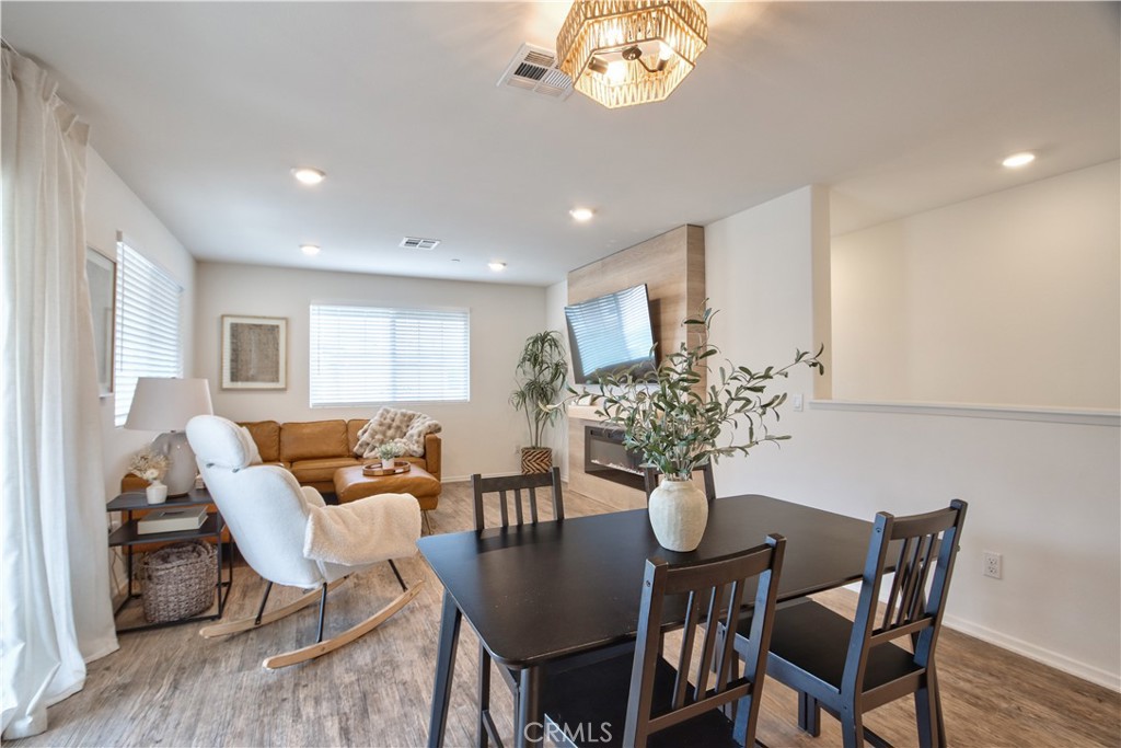 28397 Partridge Way, Unit 1001 Murrieta, CA 92563 - Photo 42 of 47 a view of a dining room with furniture and wooden floor