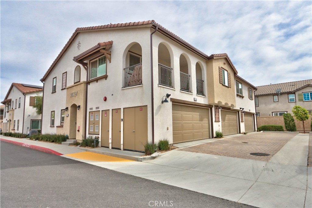 28397 Partridge Way, Unit 1001 Murrieta, CA 92563 - Photo 45 of 47 a front view of a house with a yard