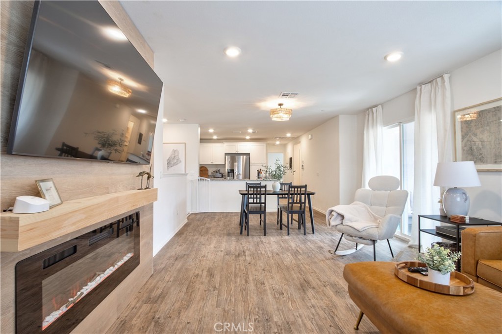 28397 Partridge Way, Unit 1001 Murrieta, CA 92563 - Photo 5 of 47 a living room with furniture and a wooden floor