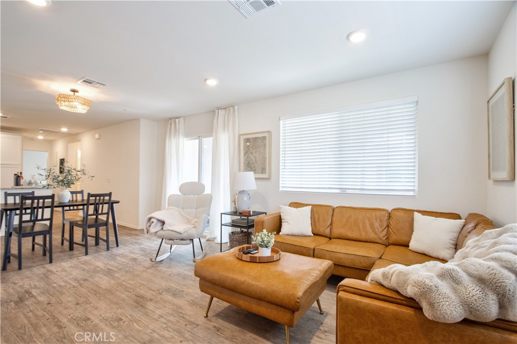 28397 Partridge Way, Unit 1001 Murrieta, CA 92563 - Photo 6 of 47 a living room with furniture and a large window