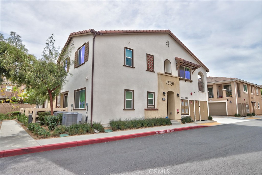 28397 Partridge Way, Unit 1001 Murrieta, CA 92563 - Photo 8 of 47 a front view of a house with a road