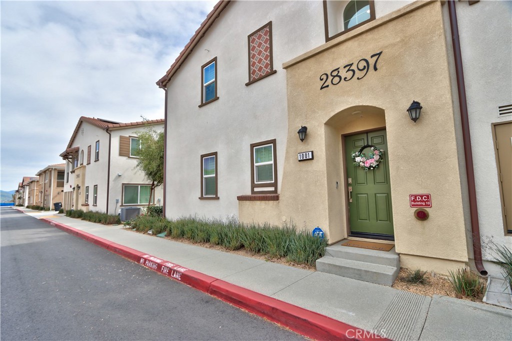 28397 Partridge Way, Unit 1001 Murrieta, CA 92563 - Photo 10 of 47 a front view of a house with a street