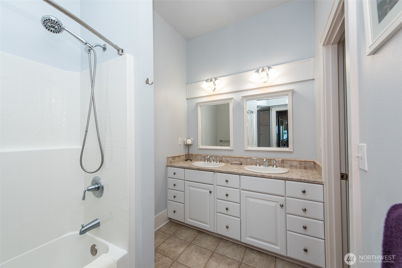 410 East Front Street Port Angeles, WA 98362 - Photo 13 of 32 a bathroom with a granite countertop sink a toilet and shower