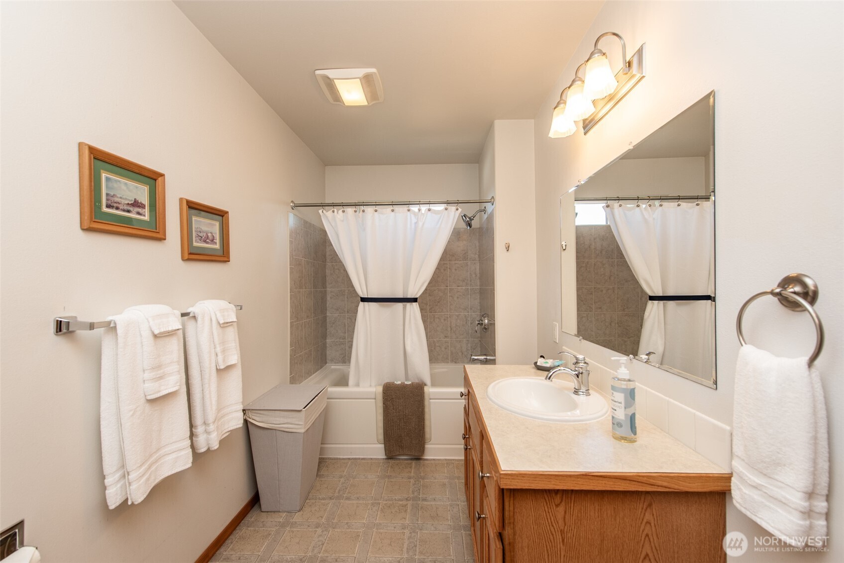 410 East Front Street Port Angeles, WA 98362 - Photo 19 of 32 a bathroom with a toilet sink and mirror