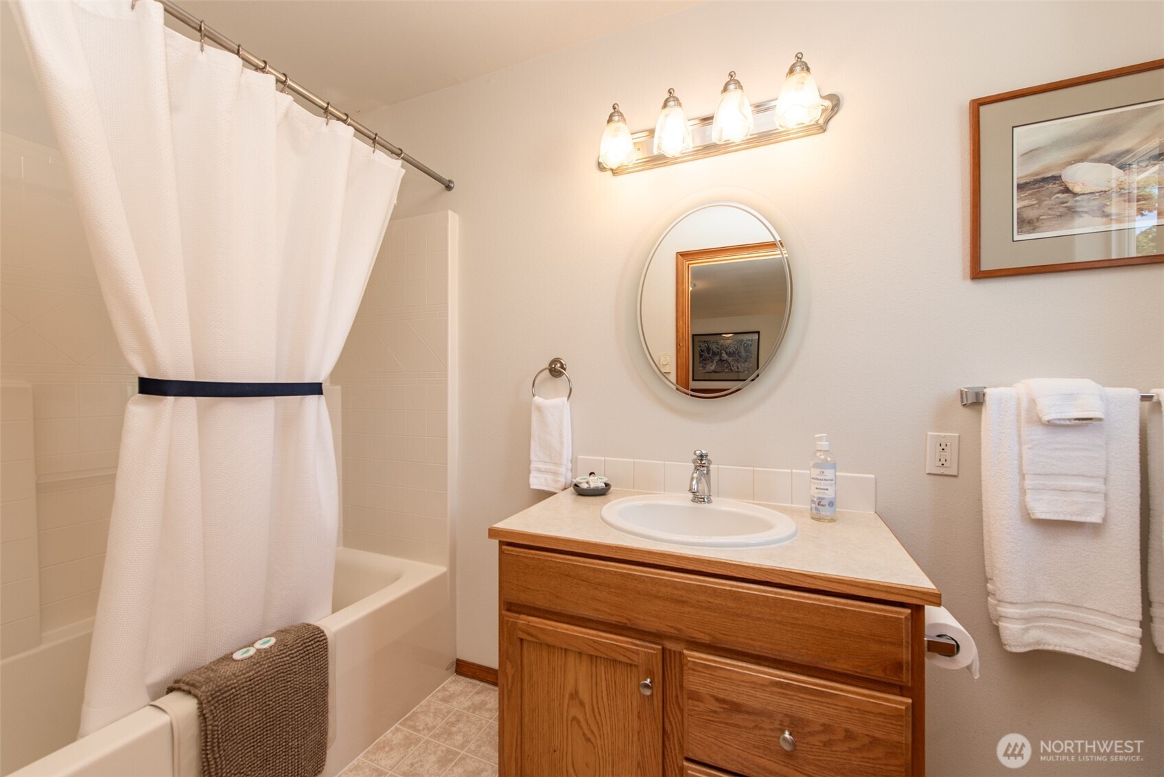 410 East Front Street Port Angeles, WA 98362 - Photo 22 of 32 a bathroom with a sink mirror and vanity
