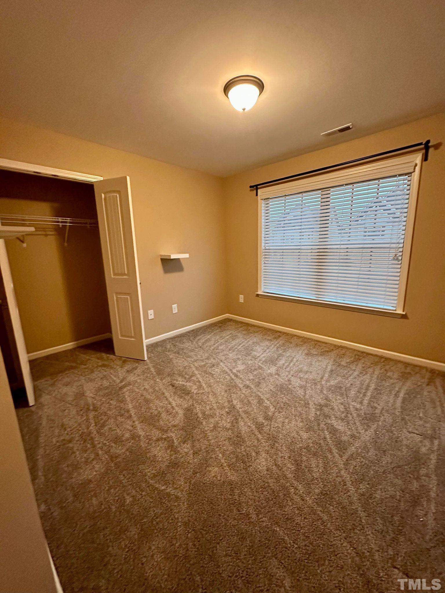 144 Bicentennial Way Cameron, NC 28326 - Photo 17 of 27 an empty room with windows