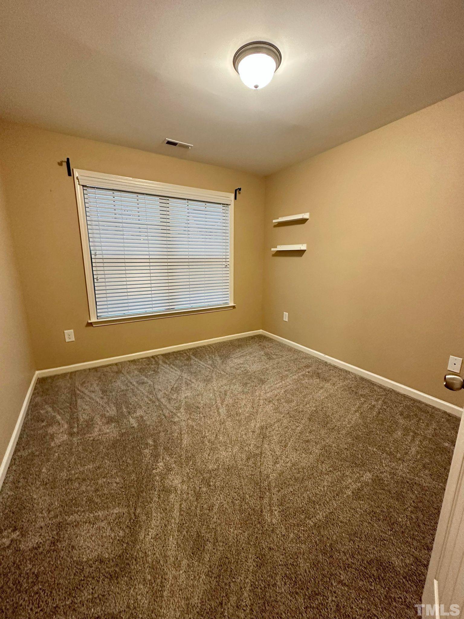 144 Bicentennial Way Cameron, NC 28326 - Photo 21 of 27 an empty room with a natural light