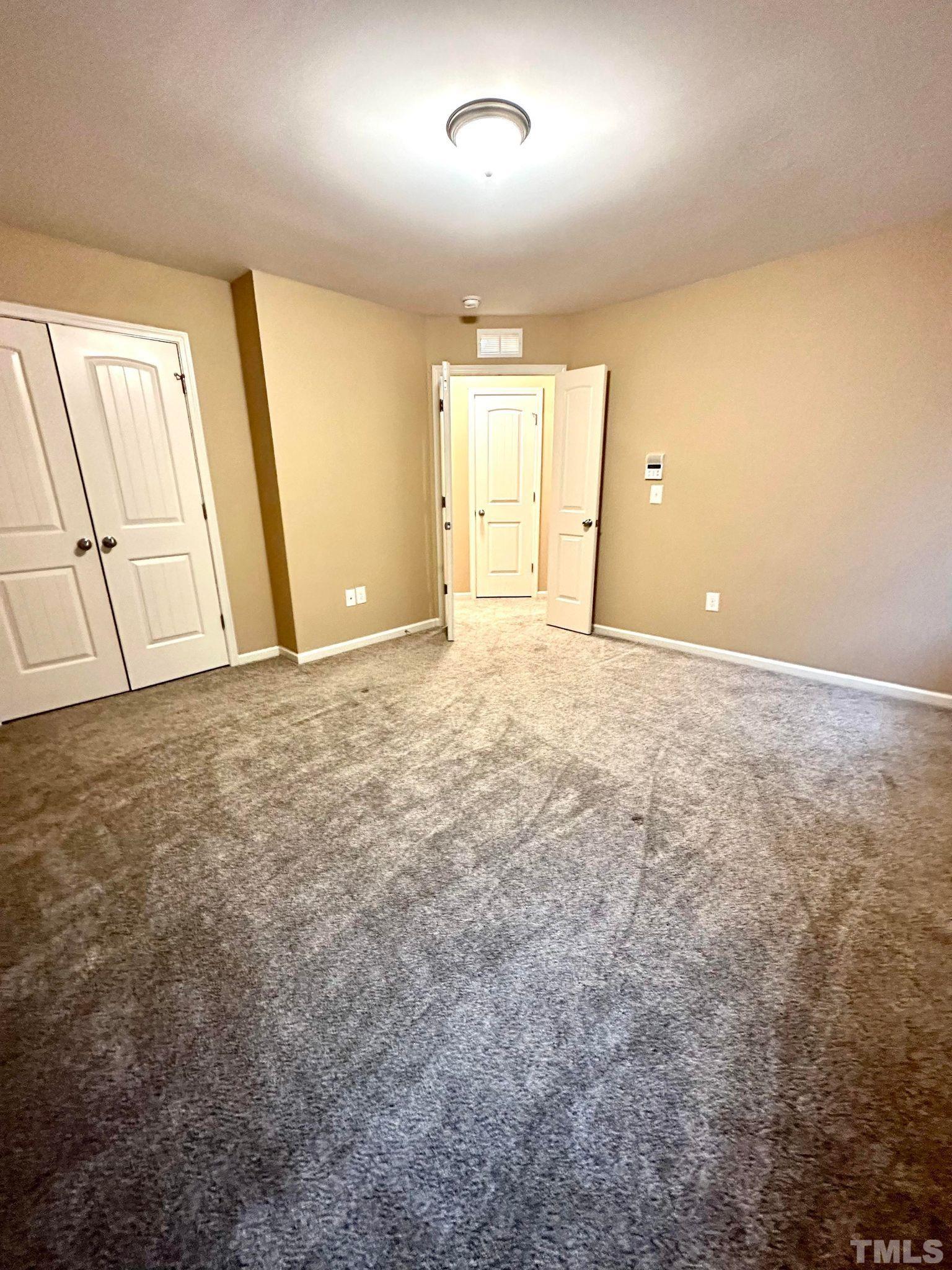 144 Bicentennial Way Cameron, NC 28326 - Photo 22 of 27 an empty room with cabinet and mirrors