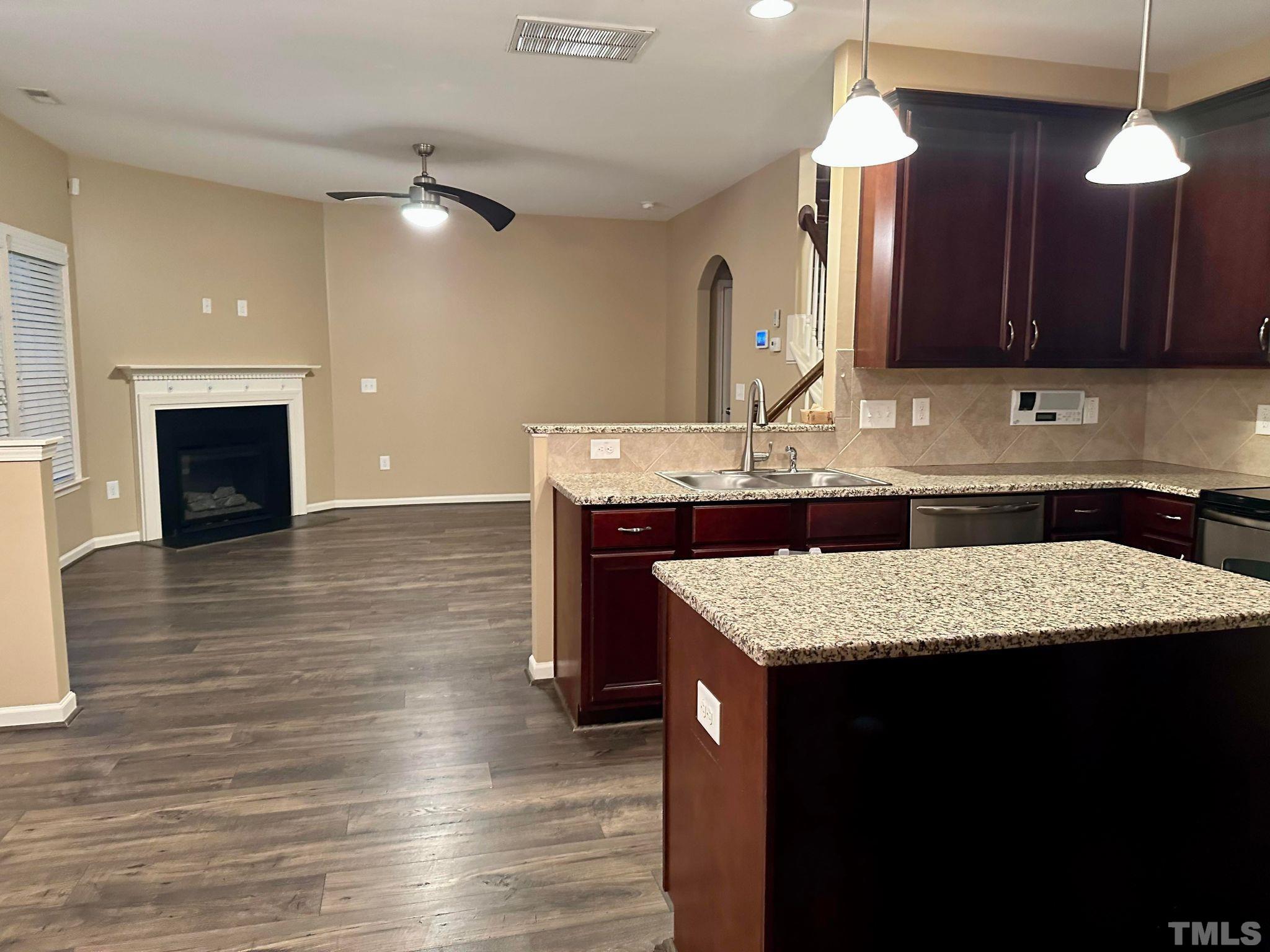 144 Bicentennial Way Cameron, NC 28326 - Photo 9 of 27 a kitchen with a sink a counter space cabinets and wooden floor