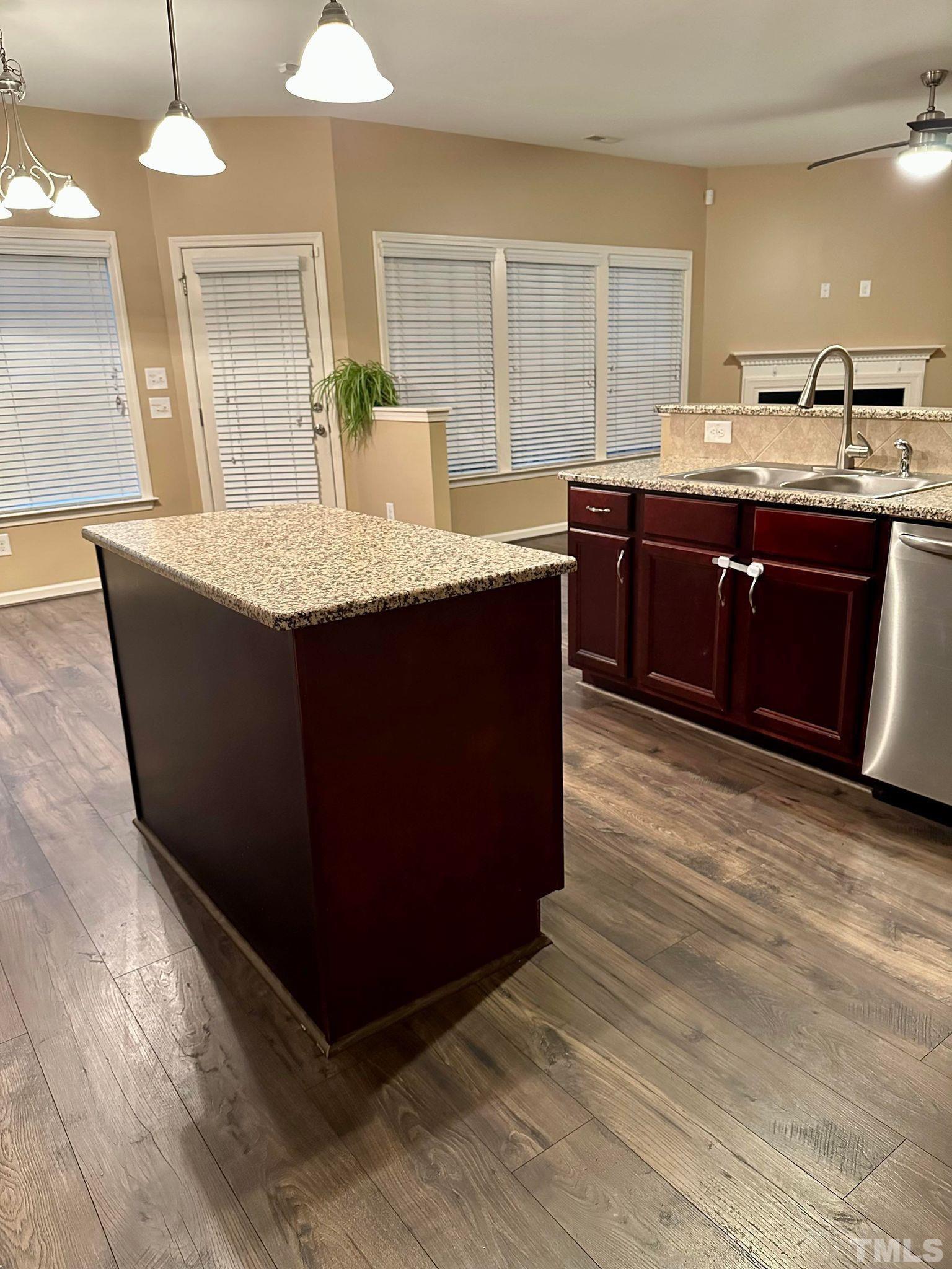 144 Bicentennial Way Cameron, NC 28326 - Photo 10 of 27 a kitchen with a sink and wooden cabinets