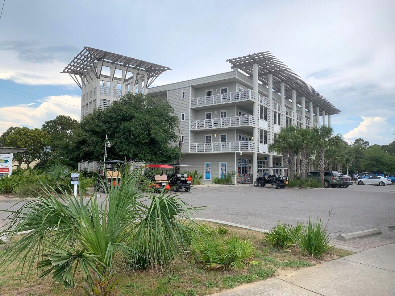 43 Cassine Way, Unit 402 Santa Rosa Beach, FL 32459 - Photo 1 of 52 a view of a chairs and table in the yard