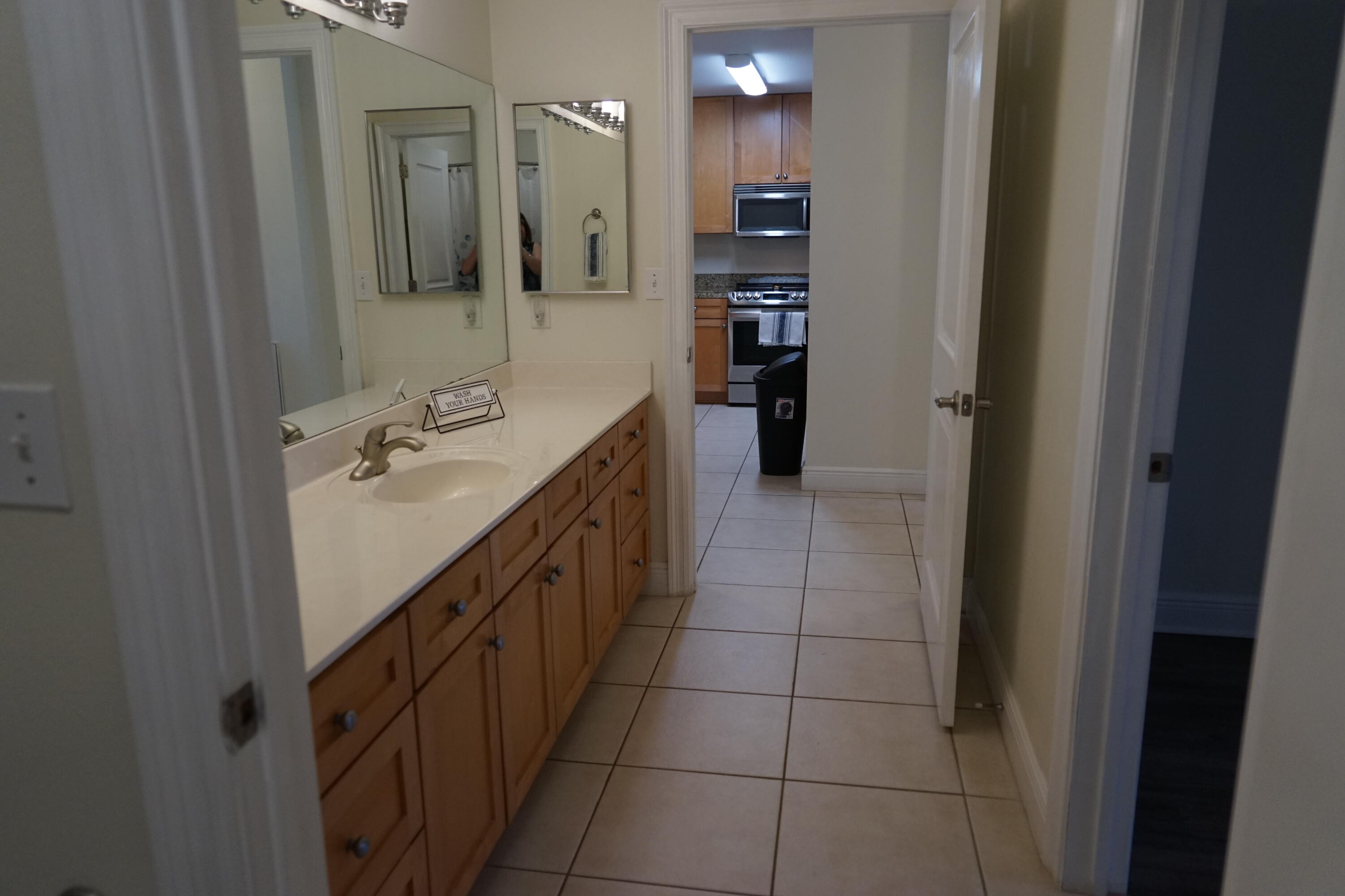 43 Cassine Way, Unit 402 Santa Rosa Beach, FL 32459 - Photo 12 of 52 a bathroom with a sink a vanity and a mirror