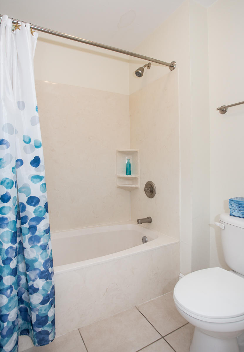 43 Cassine Way, Unit 402 Santa Rosa Beach, FL 32459 - Photo 13 of 52 a bathroom with a toilet and a bathtub
