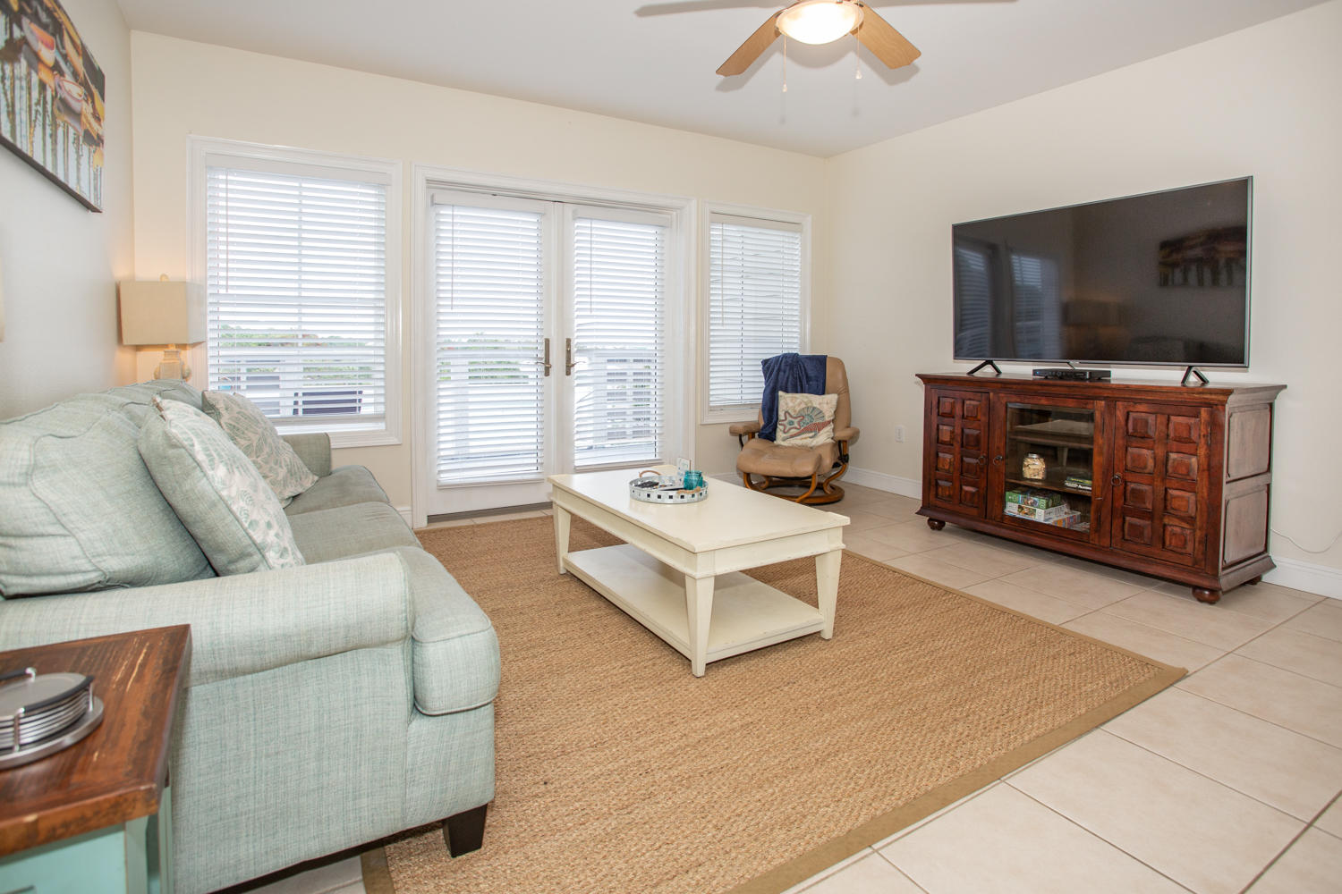 43 Cassine Way, Unit 402 Santa Rosa Beach, FL 32459 - Photo 16 of 52 a living room with furniture and a flat screen tv