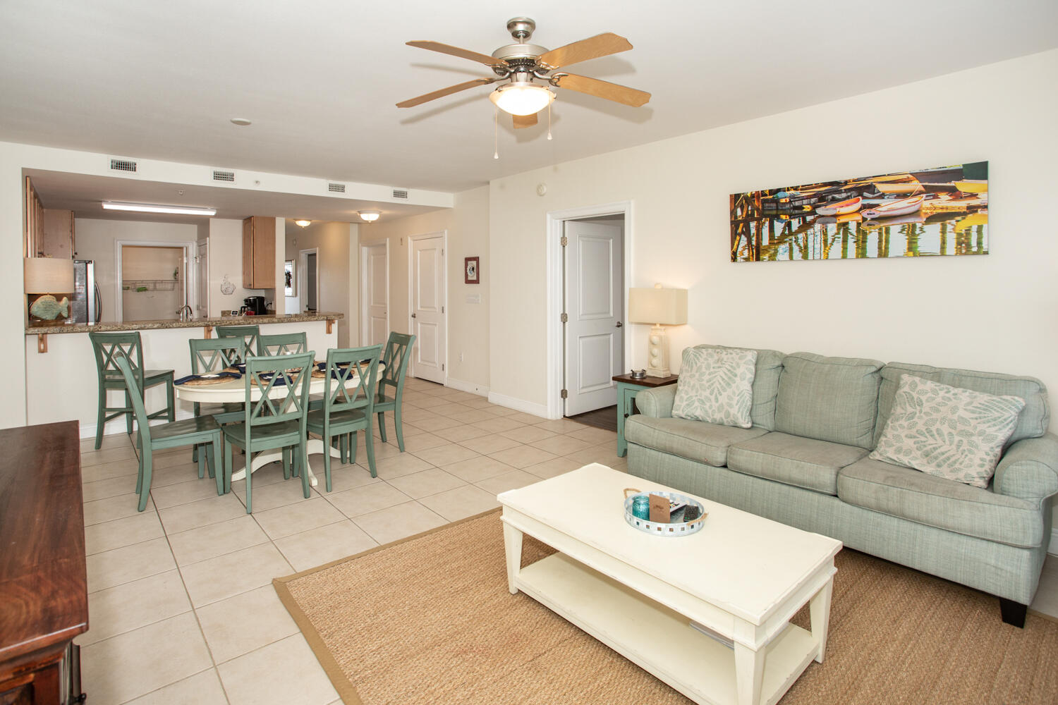 43 Cassine Way, Unit 402 Santa Rosa Beach, FL 32459 - Photo 18 of 52 a living room with furniture a wooden floor and a ceiling fan