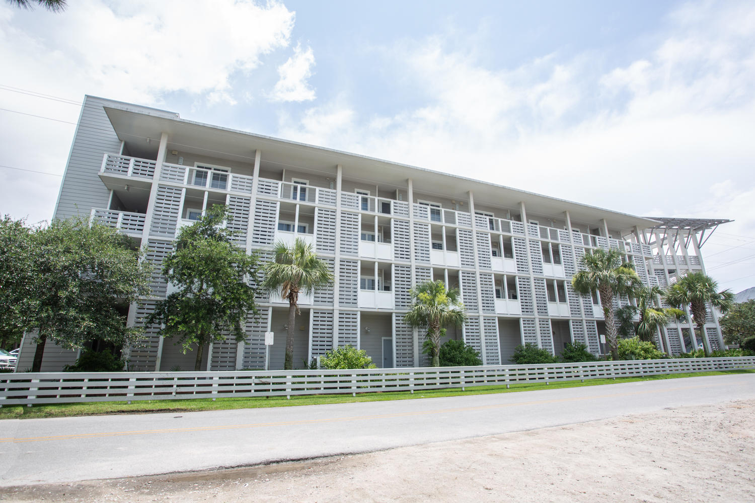 43 Cassine Way, Unit 402 Santa Rosa Beach, FL 32459 - Photo 3 of 52 a view of a brick building next to a yard