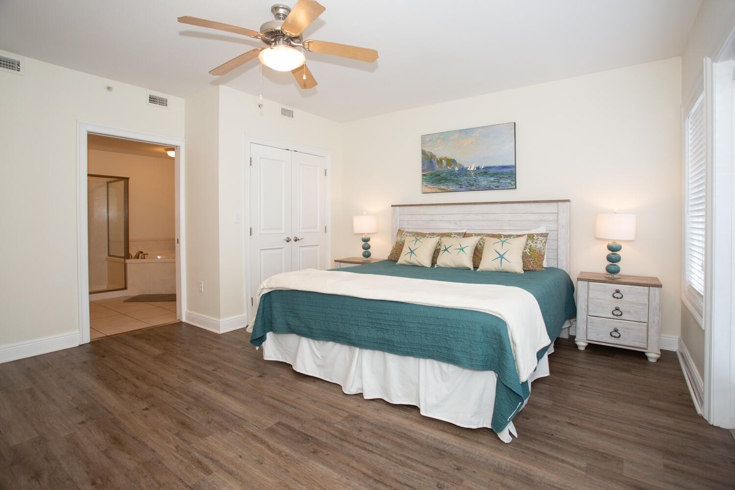 43 Cassine Way, Unit 402 Santa Rosa Beach, FL 32459 - Photo 29 of 52 a bedroom with a bed and a chandelier