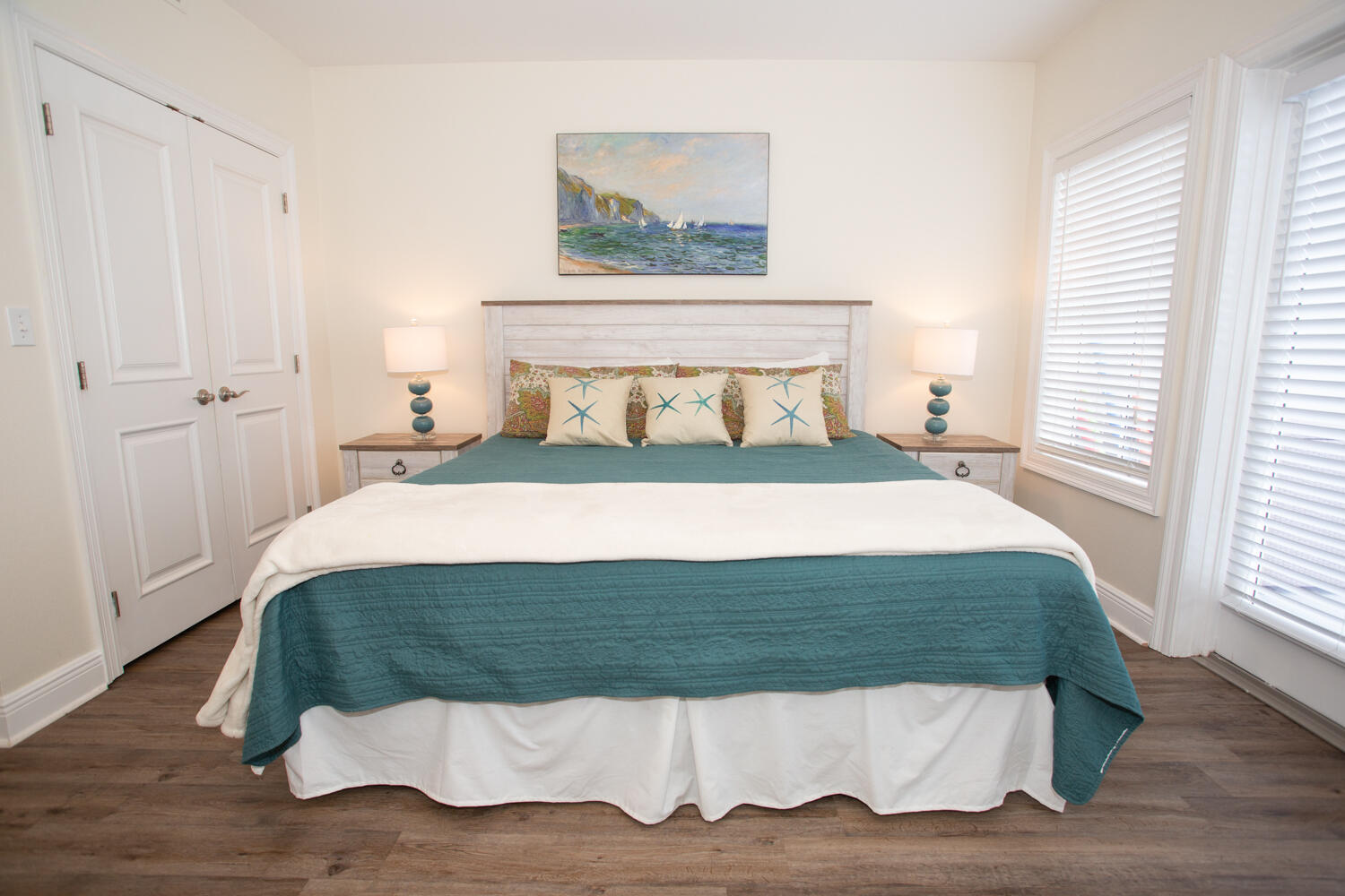43 Cassine Way, Unit 402 Santa Rosa Beach, FL 32459 - Photo 30 of 52 a bedroom with a bed and wooden floor