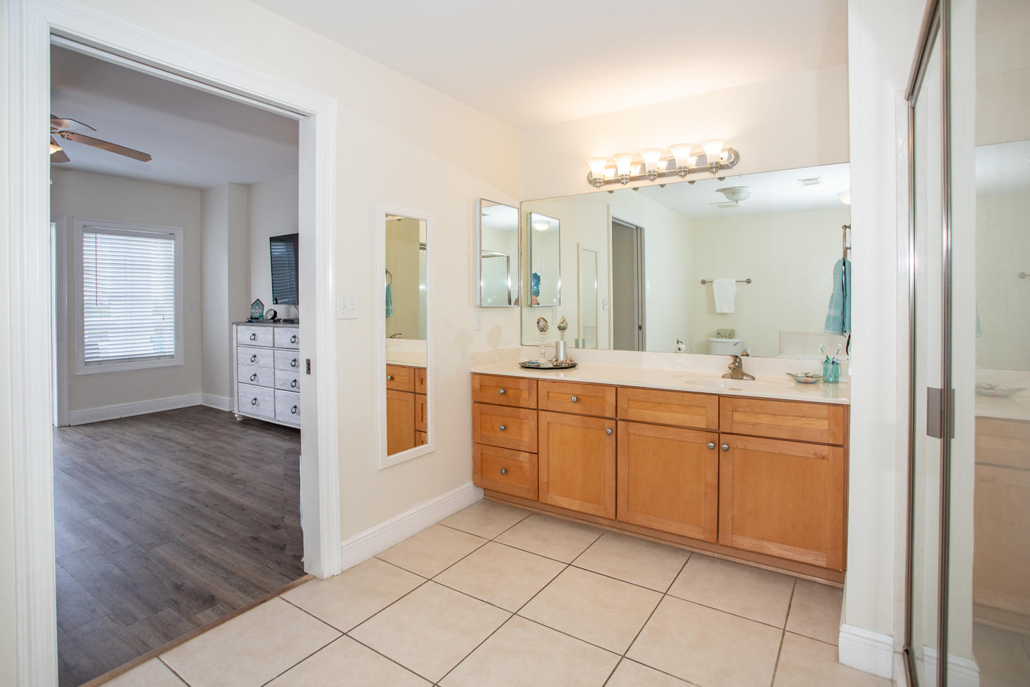 43 Cassine Way, Unit 402 Santa Rosa Beach, FL 32459 - Photo 34 of 52 a spacious bathroom with a double vanity sink a mirror and a