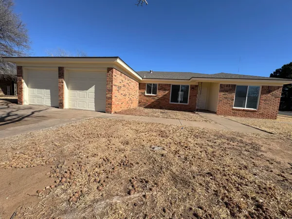 a front view of a house with yard