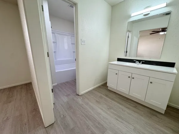 a view of a hallway view with wooden floor