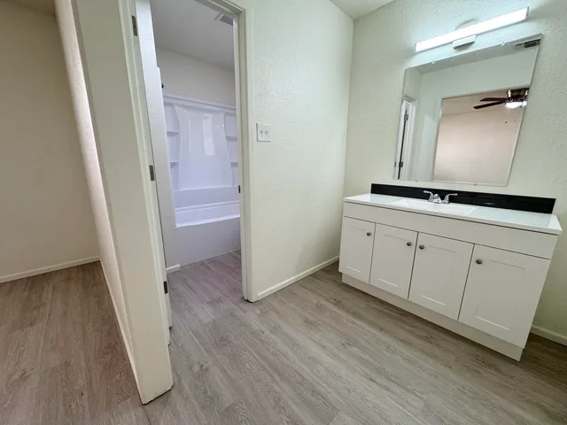a view of a hallway view with wooden floor
