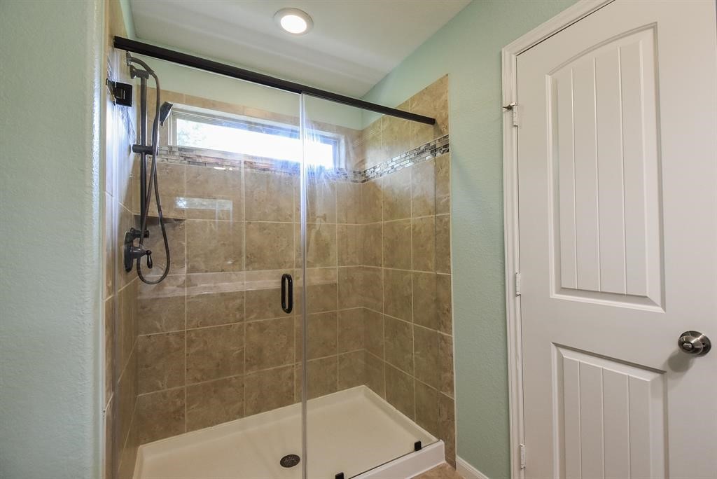 7002 Edwanna Lane Spring, TX 77389 - Photo 12 of 17 a bathroom with a shower and a sink
