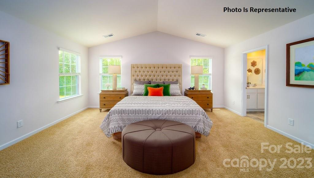 2116 Vanderlyn Street Monroe, NC 28112 - Photo 12 of 14 a bedroom with a bed and window