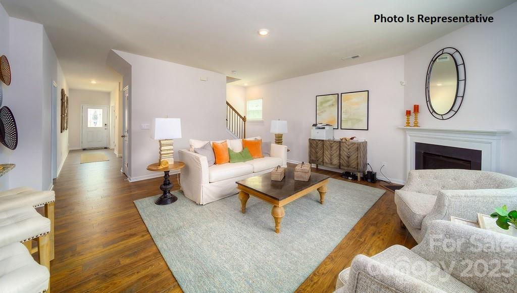 2116 Vanderlyn Street Monroe, NC 28112 - Photo 5 of 14 a living room with furniture and a fireplace