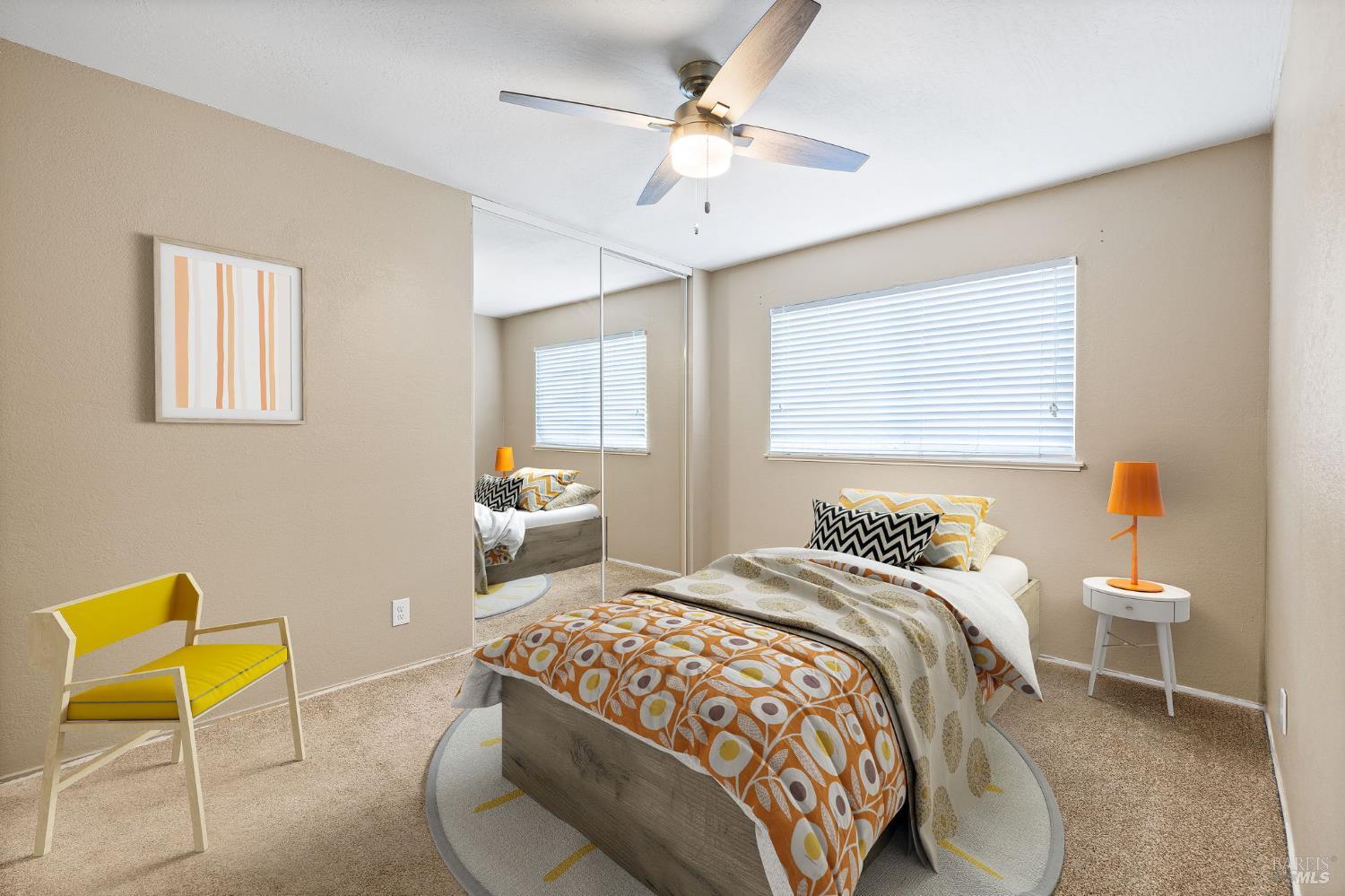 414 Brunswick Drive Vallejo, CA 94591 - Photo 5 of 73 a bedroom with a bed a chair and a chandelier