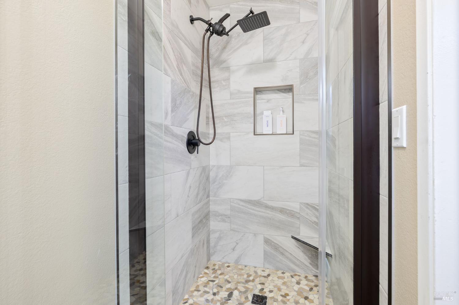 414 Brunswick Drive Vallejo, CA 94591 - Photo 52 of 73 a bathroom with a glass shower door