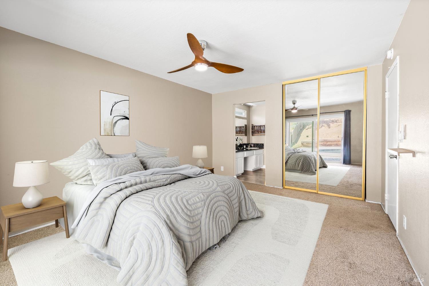 414 Brunswick Drive Vallejo, CA 94591 - Photo 6 of 73 a bedroom with a large bed and a chandelier