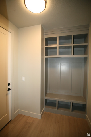 635 East Mountain Road North Ogden, UT 84414 - Photo 27 of 33 Built-in organizational unit featuring upper cubbies, board and batten paneling, a bench, and lower storage compartments