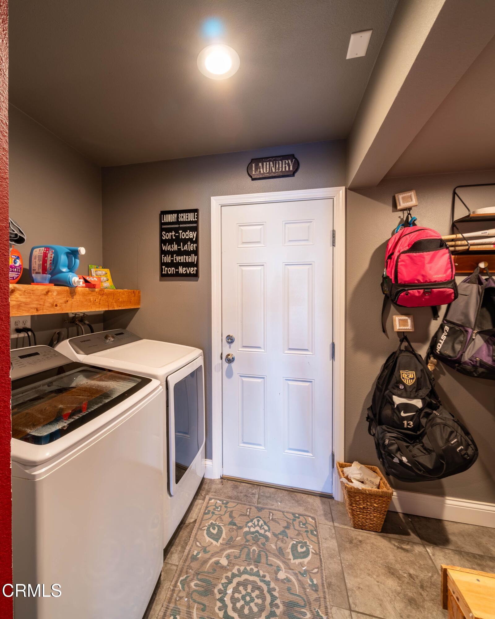 911 Indigo Place Oxnard, CA 93036 - Photo 10 of 30 a kitchen that has a stove and a wooden floor
