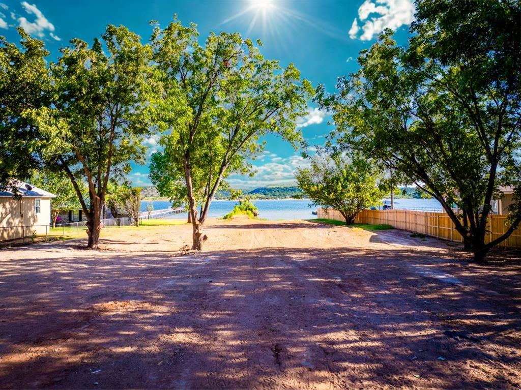 4468 Chapel Road Graham, TX 76450 - Photo 37 of 39 The Lot with 0.629acres of open Level Space and Walk In Lake Access and Sandy Beach
