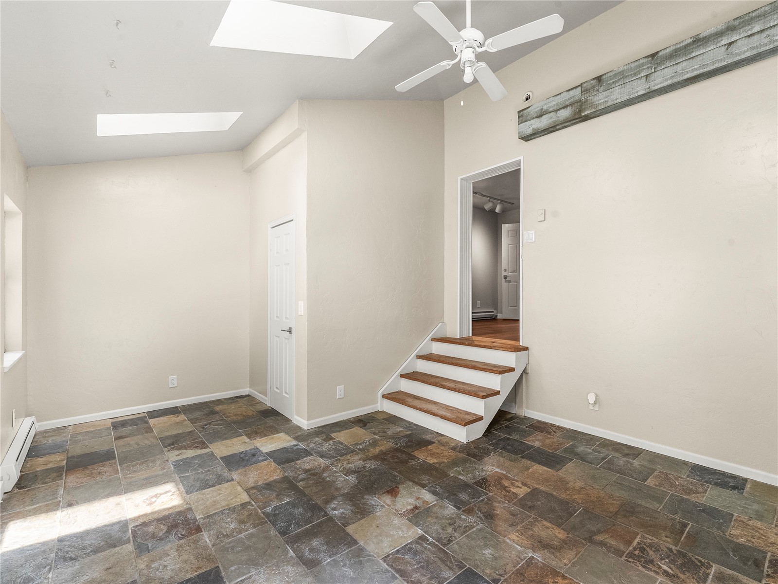 201 Bunker Hill Lode Road, Unit 6 Breckenridge, CO 80424 - Photo 13 of 20 a view of a room with a fireplace and windows