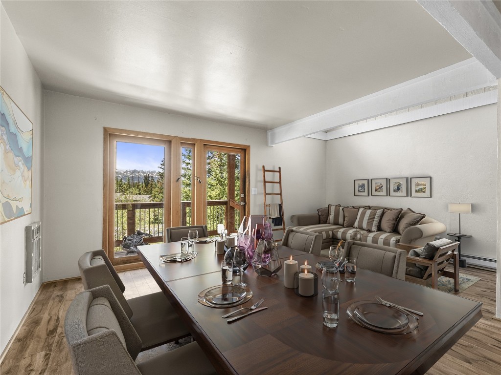 201 Bunker Hill Lode Road, Unit 6 Breckenridge, CO 80424 - Photo 3 of 20 a view of a dining room with furniture window and outside view