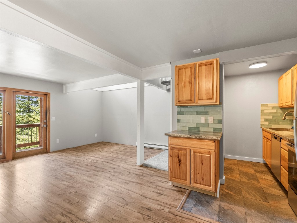 201 Bunker Hill Lode Road, Unit 6 Breckenridge, CO 80424 - Photo 6 of 20 an empty room with windows and cabinet