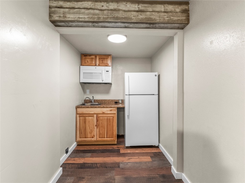 201 Bunker Hill Lode Road, Unit 6 Breckenridge, CO 80424 - Photo 9 of 20 a view of a kitchen with refrigerator and stove
