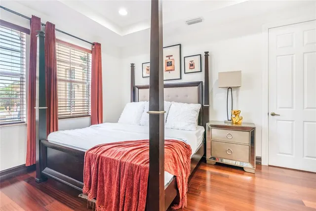 a bathroom with a granite countertop toilet sink and mirror